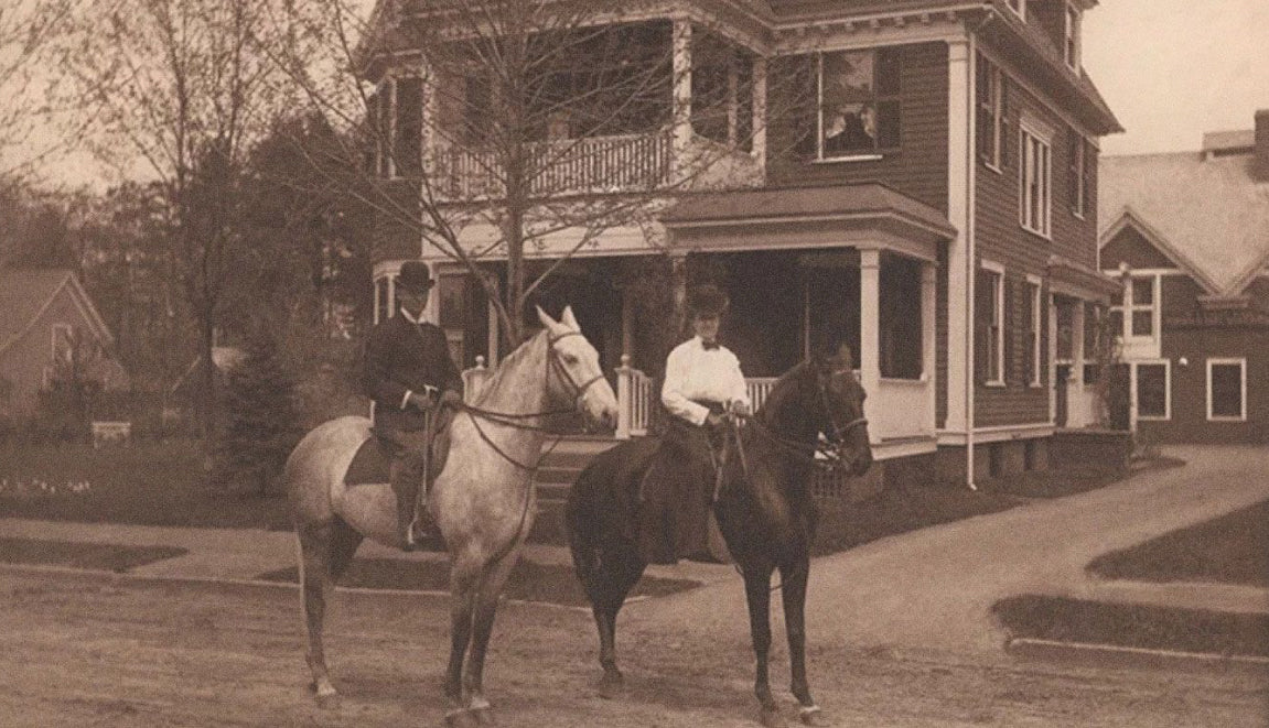 Wilbur and Mary Ida riding their horses in a neighborhood with Victorian homes in the background.  Photo was taken back in 1892.